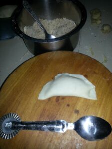 stuffed karanji waiting to be fried