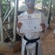 Arnav with his black belt certificate from JKA